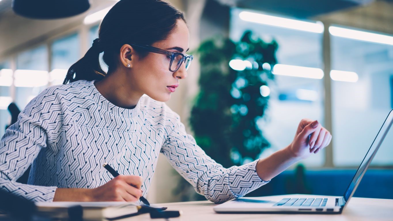 IT integration woman looking at laptop