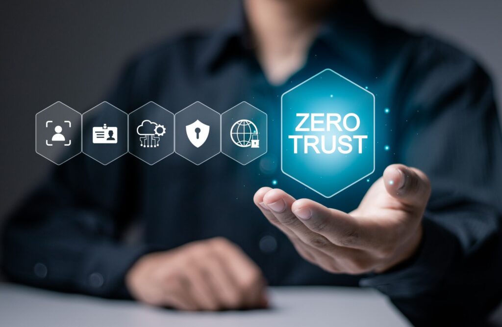Zero trust security concept, Businessman holding zero trust icon on virtual screen for business information security network.