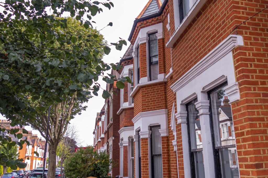 Location data - Red brick terraced houses and a tree on the left. 