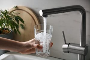 South West Water - Filling up glass with tap water from faucet