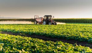 Agrovista - Tractor in a farm field harvesting