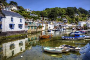 Duchy of Cornwall - Nansledan seaside harbour with boats docked in the ocean