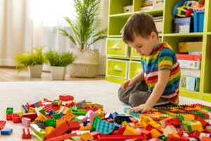 Brighton and Hove's Children's Centre - Child playing with lego toys