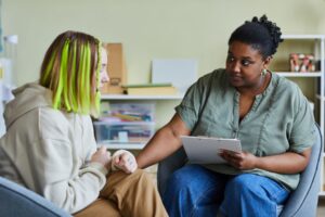 St Helens Youth Justice Service - Youth worker helping teenager during a counselling session