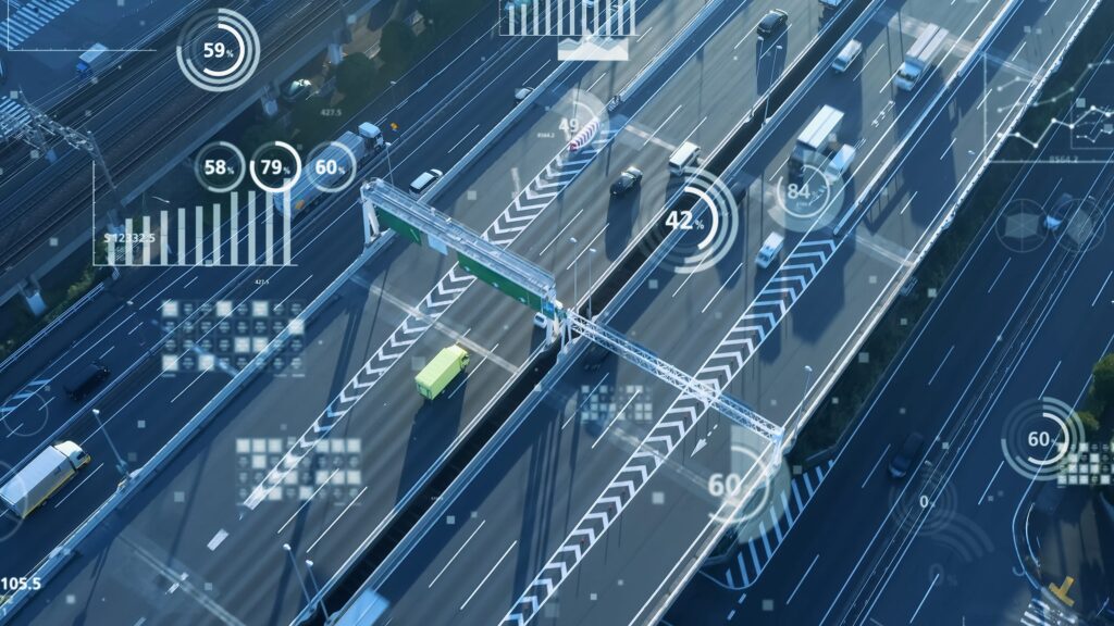 Logistics Data - Illustration of the data produced in logistics. Charts and data visualisations are overlaid over a motorway bypass.