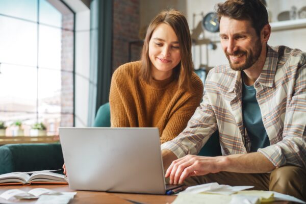 Couple working together on a laptop