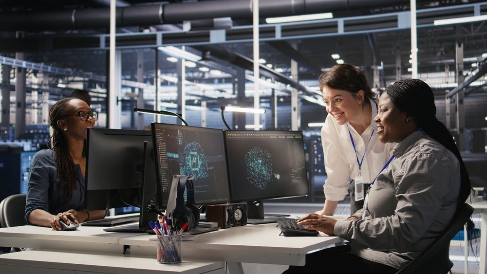 SD-WAN Managed Services - Cheerful data center technicians satisfied with results after collaborating on AI automation deployment